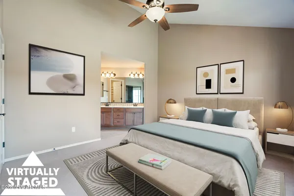 a spacious bathroom with a granite countertop sink a toilet and a mirror
