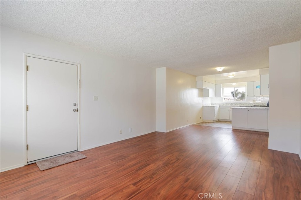 4012 West 133rd Street, Unit 8 Hawthorne, CA 90250 - Photo 5 of 20 a view of a kitchen with wooden floor and a kitchen