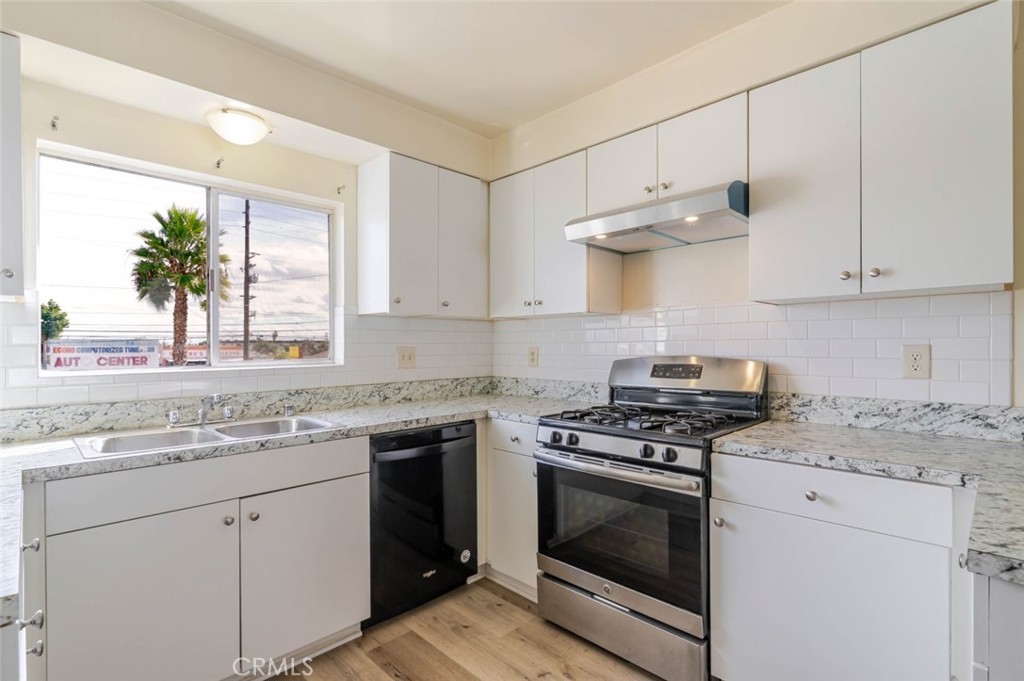 4012 West 133rd Street, Unit 8 Hawthorne, CA 90250 - Photo 7 of 20 a kitchen with cabinets stainless steel appliances and a counter space