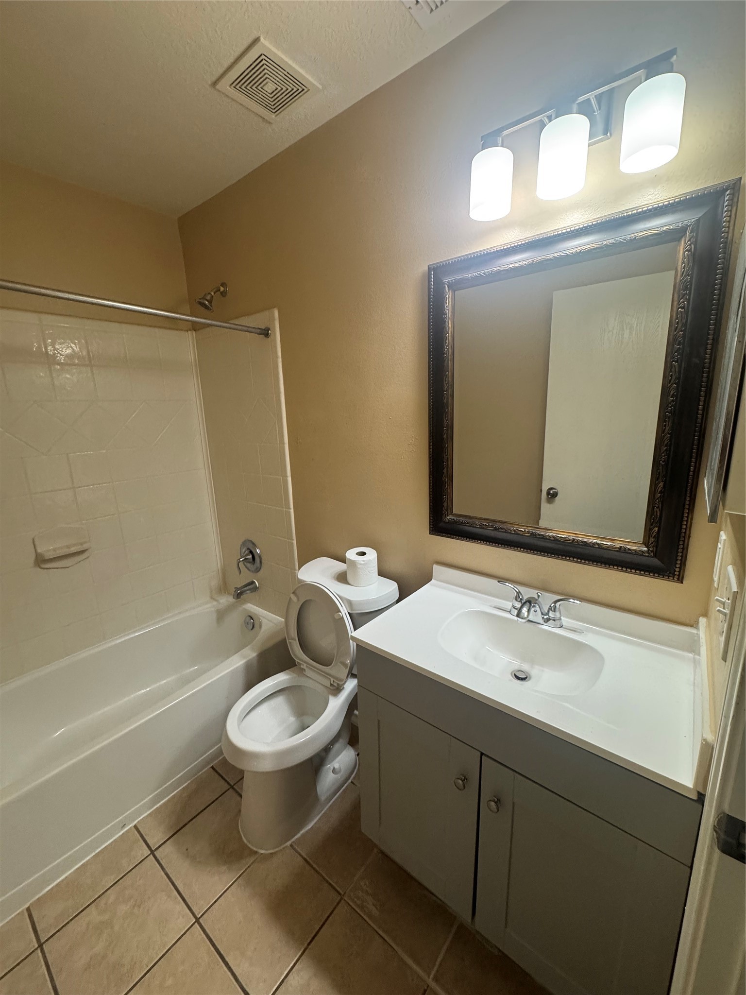 10906 View Pointe Lane Houston, TX 77034 - Photo 8 of 9 a bathroom with a sink a toilet a mirror and shower