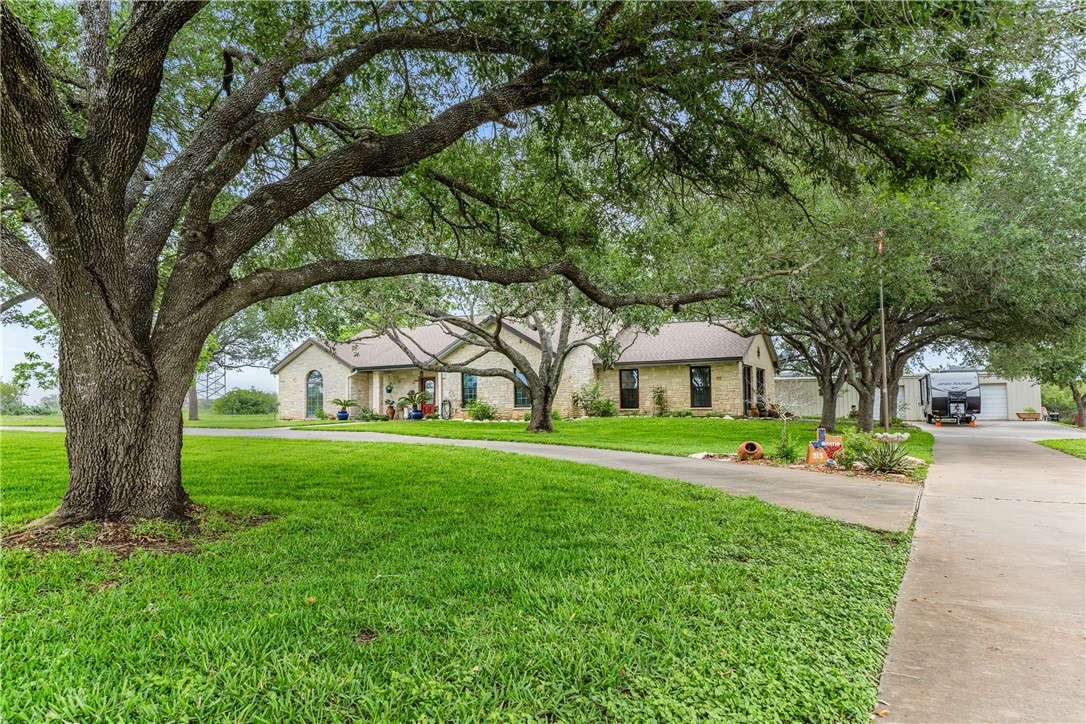 345 Trail Ridge Drive Sandia, TX 78383 - Photo 7 of 40 a view of a big yard next to a house