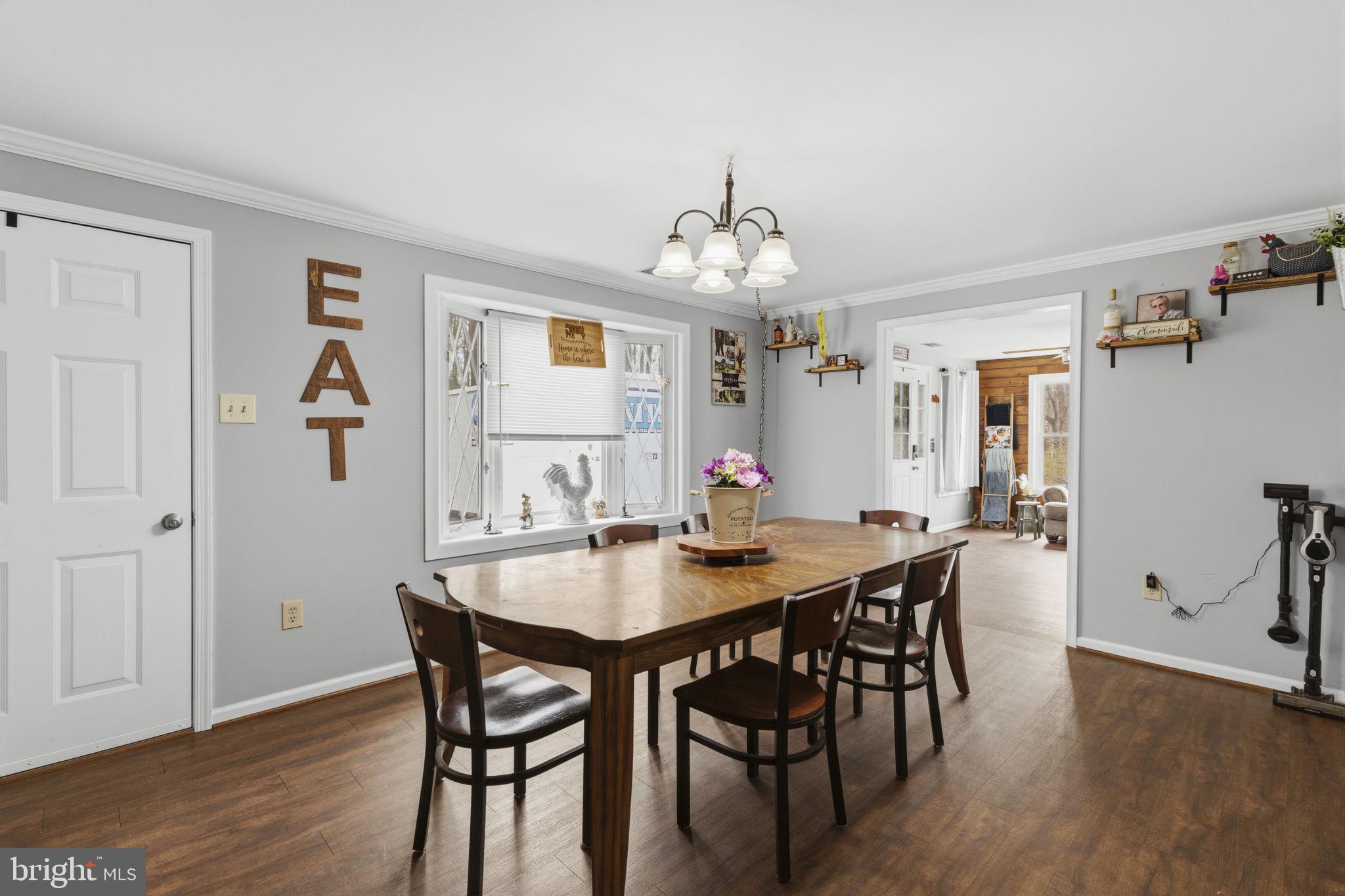 11910 Warner Road Keymar, MD 21757 - Photo 13 of 51 a view of a dining room with furniture and wooden floor