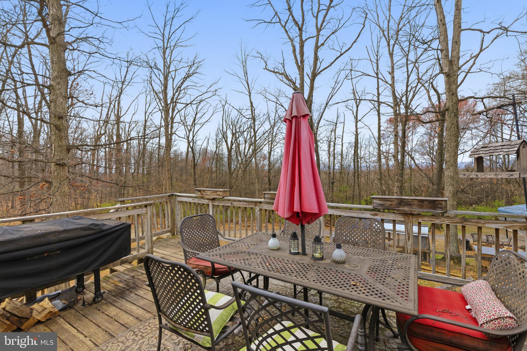 11910 Warner Road Keymar, MD 21757 - Photo 31 of 51 a view of deck with chairs and wooden fence