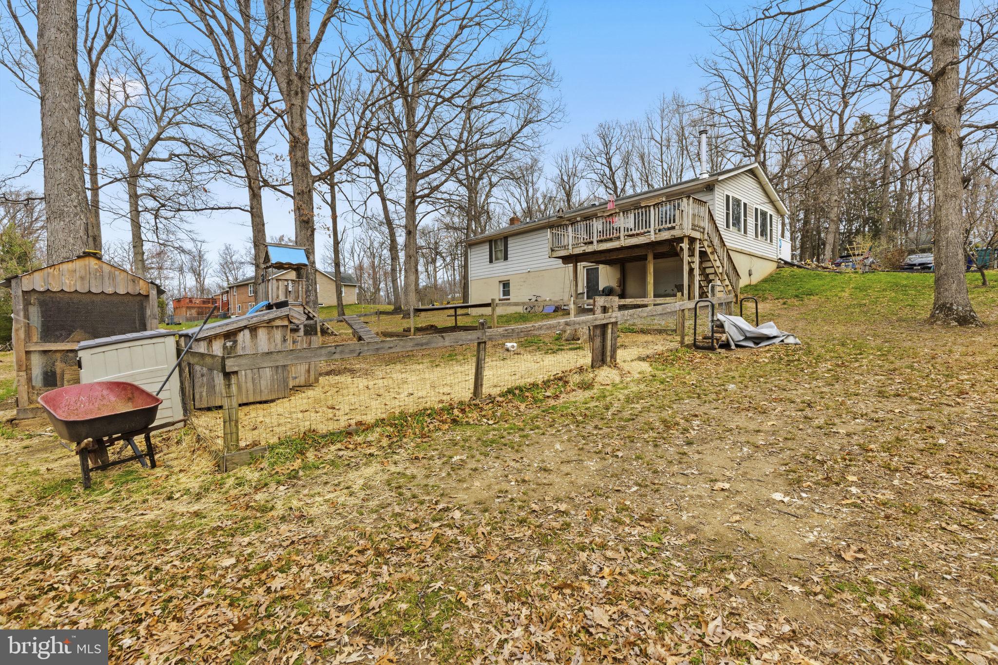 11910 Warner Road Keymar, MD 21757 - Photo 41 of 51 a view of a lake with a bench and trees