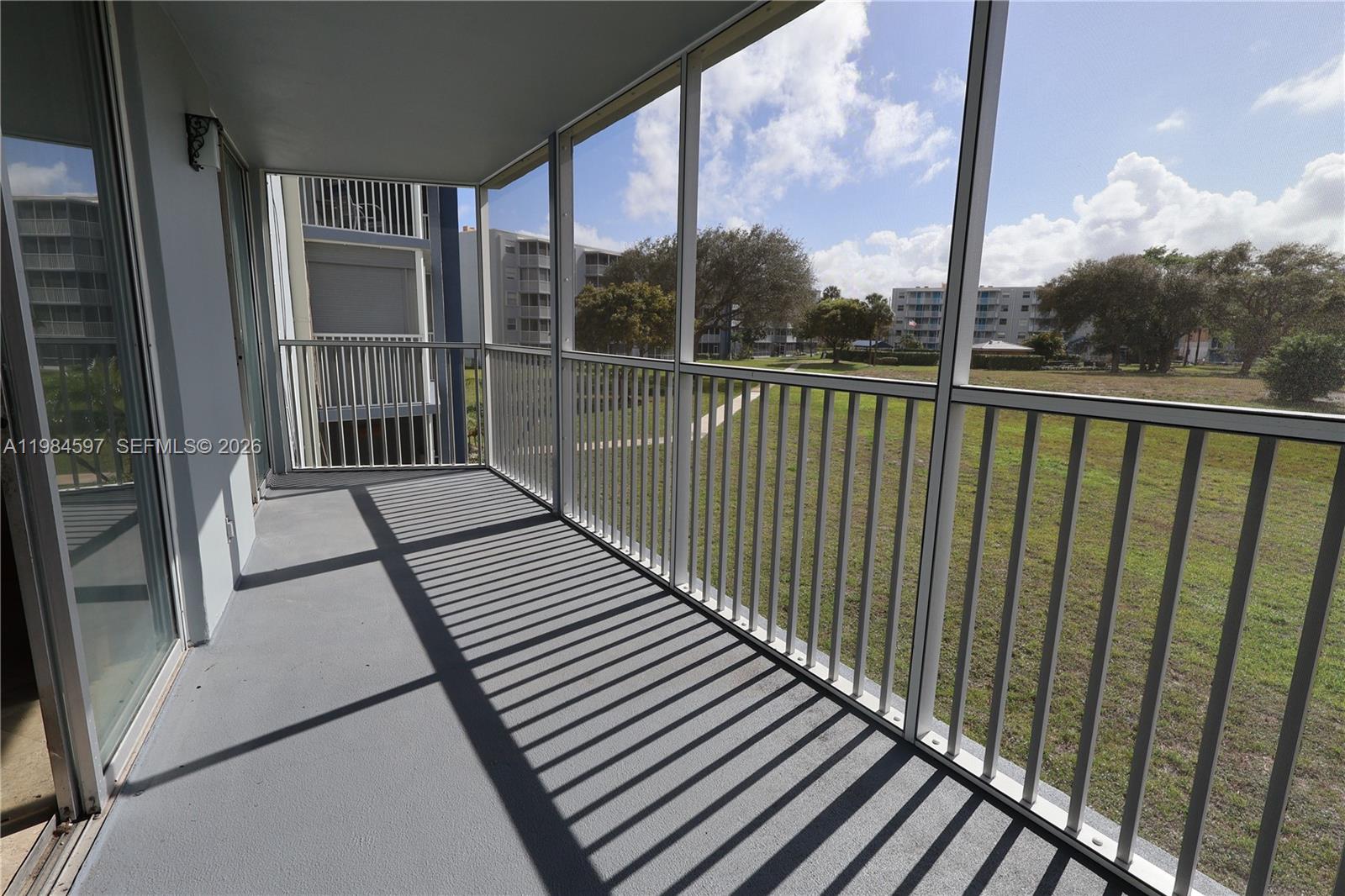 5301 Northwest 2nd Avenue, Unit 203 Boca Raton, FL 33487 - Photo 12 of 17 a view of balcony with wooden floor