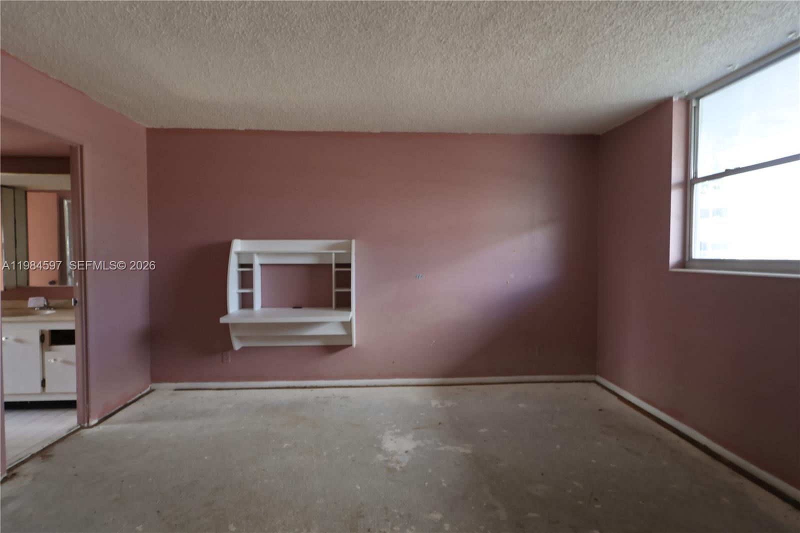 5301 Northwest 2nd Avenue, Unit 203 Boca Raton, FL 33487 - Photo 13 of 17 an empty room with windows