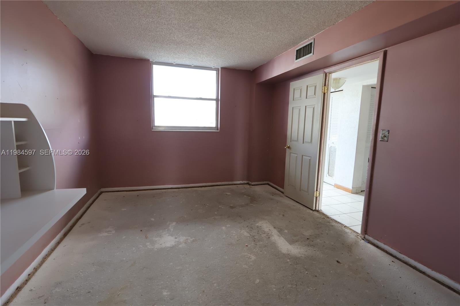 5301 Northwest 2nd Avenue, Unit 203 Boca Raton, FL 33487 - Photo 14 of 17 a view of empty room with window