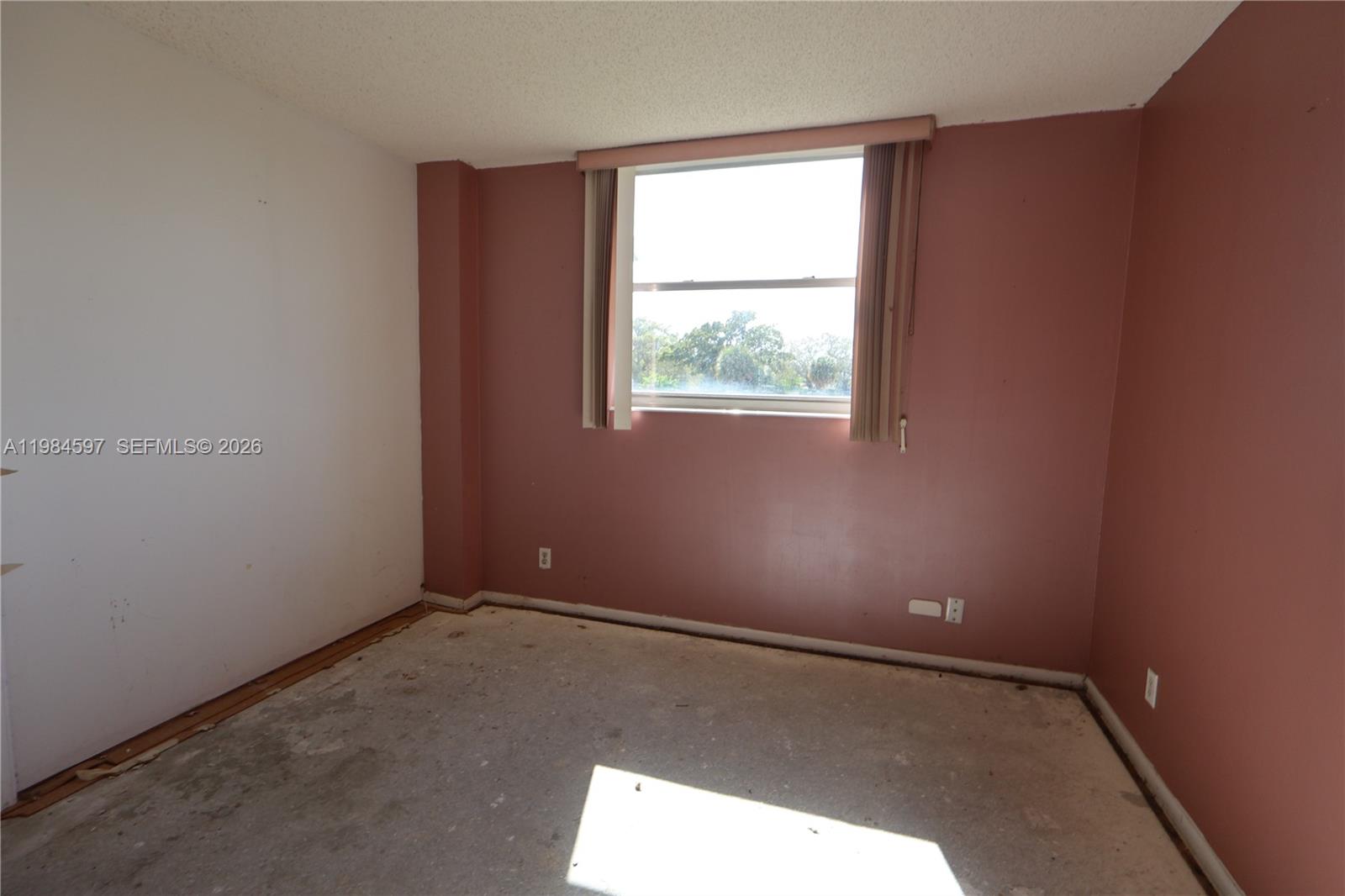 5301 Northwest 2nd Avenue, Unit 203 Boca Raton, FL 33487 - Photo 16 of 17 an empty room with a window