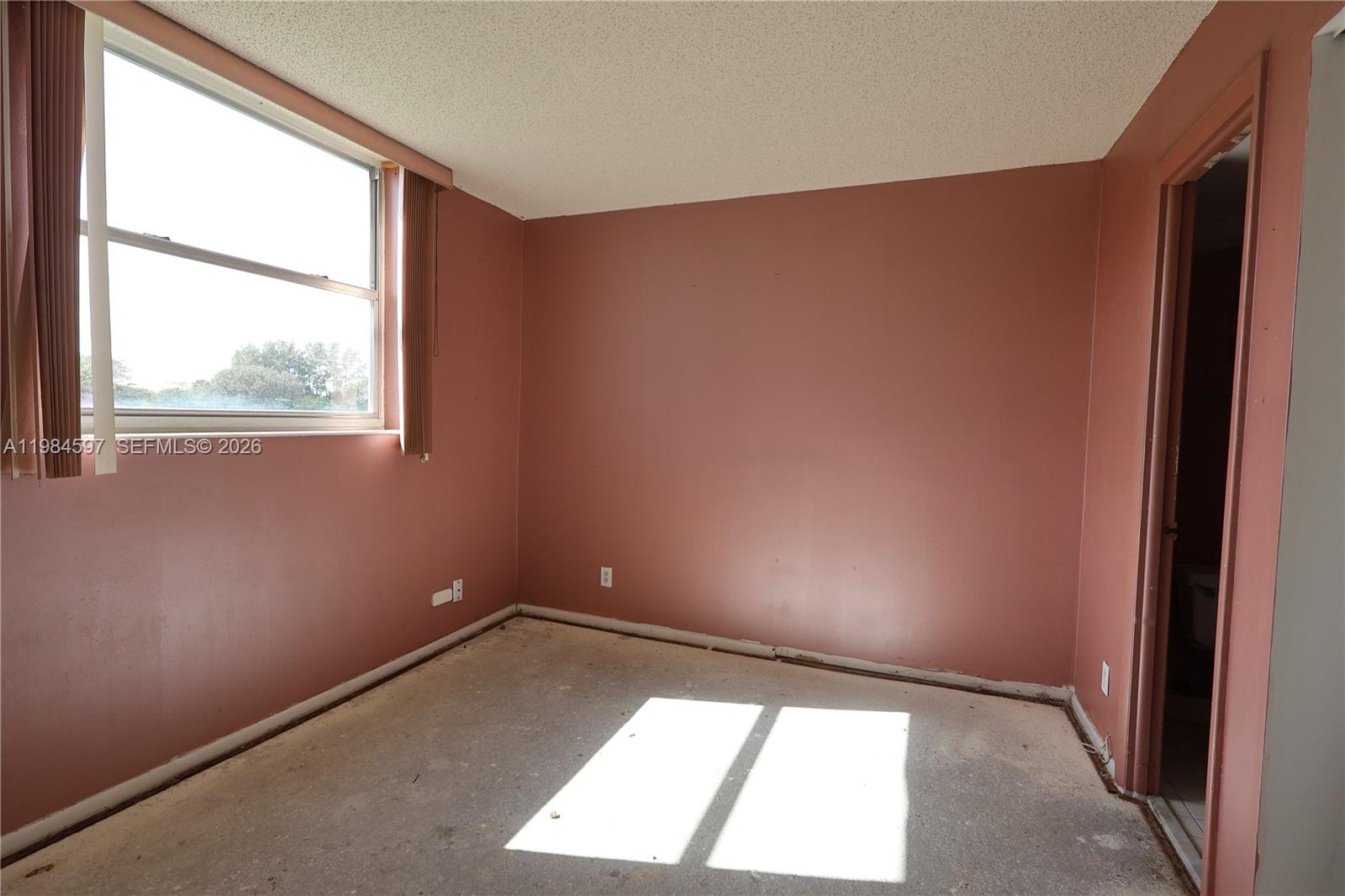 5301 Northwest 2nd Avenue, Unit 203 Boca Raton, FL 33487 - Photo 17 of 17 an empty room with a window