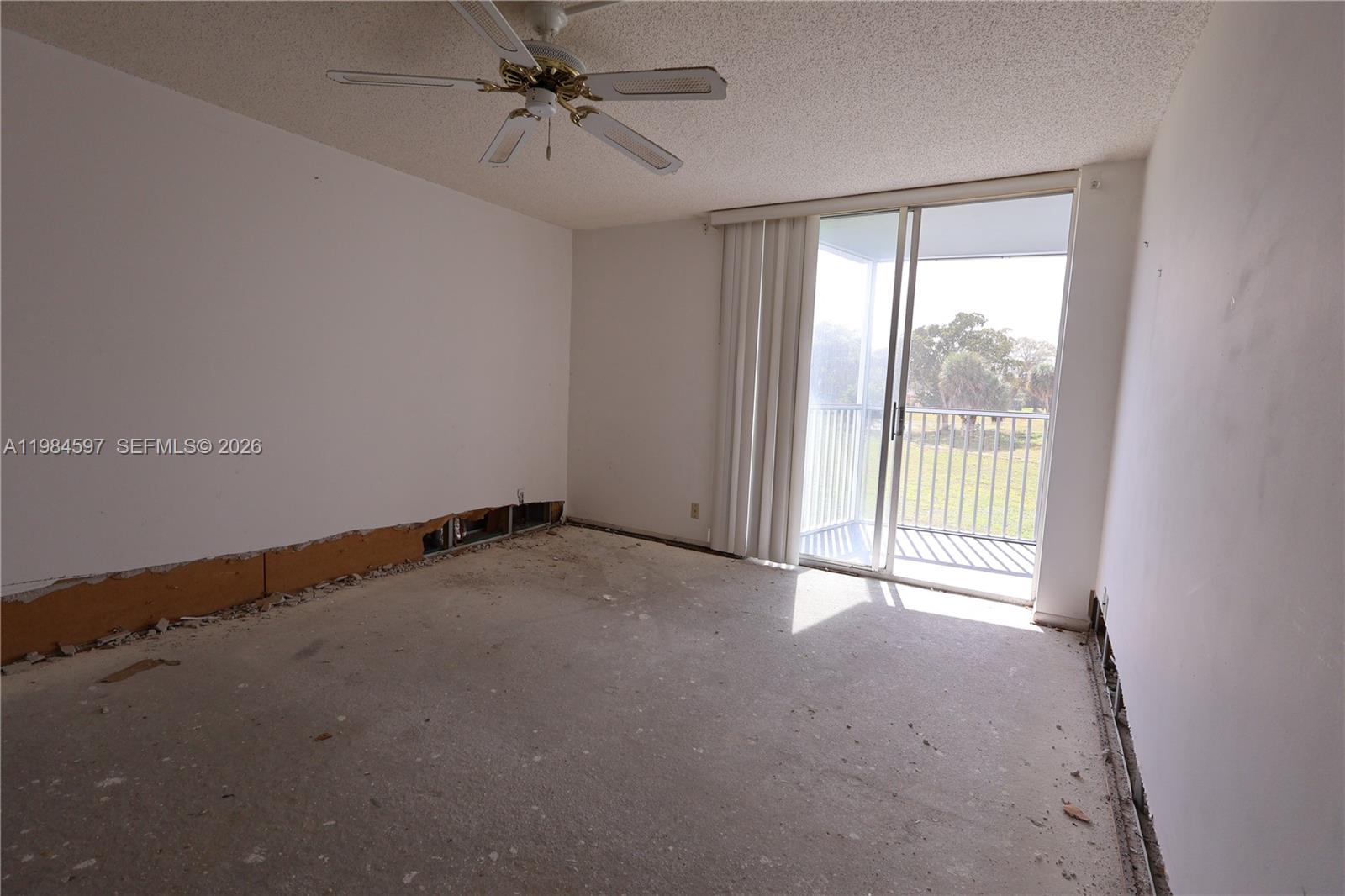 5301 Northwest 2nd Avenue, Unit 203 Boca Raton, FL 33487 - Photo 7 of 17 a view of an empty room with a window