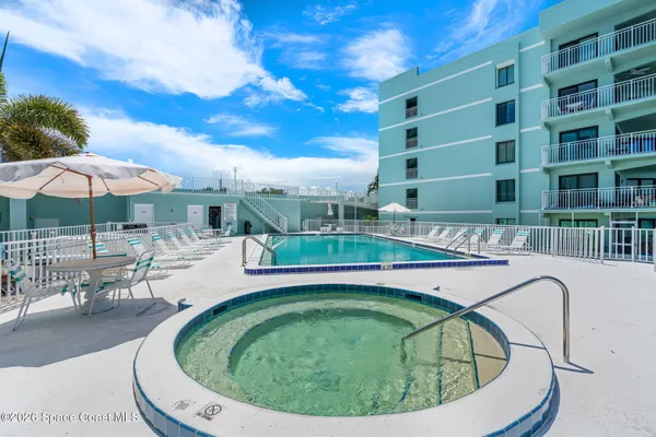 a view of a swimming pool with a patio