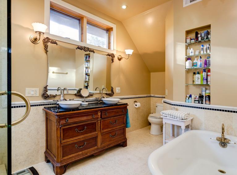 4230 Thacher Road Ojai, CA 93023 - Photo 15 of 22 a bathroom with a double vanity sink a toilet and a mirror