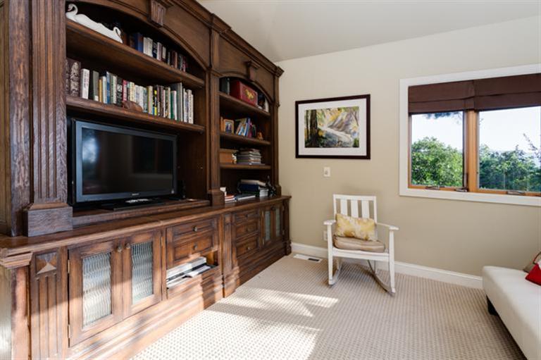 4230 Thacher Road Ojai, CA 93023 - Photo 17 of 22 a living room with a large window and a flat screen tv