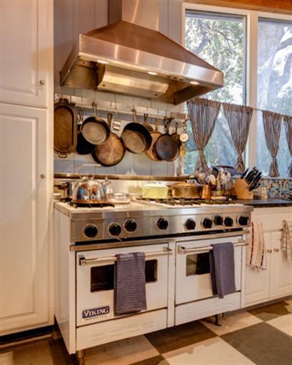 4230 Thacher Road Ojai, CA 93023 - Photo 8 of 22 a stove top oven sitting inside of a kitchen