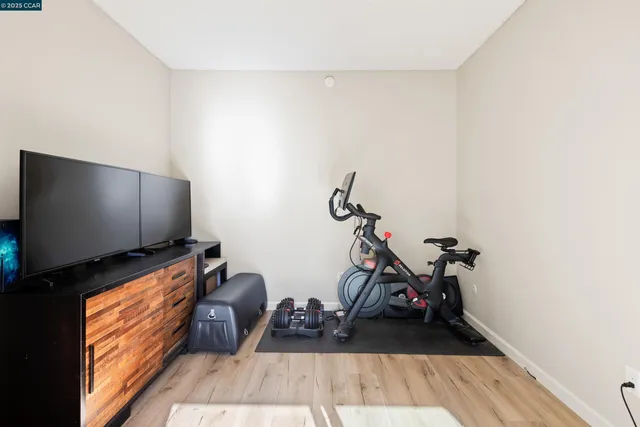a room with furniture and a flat screen tv