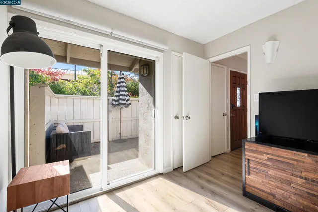a view of a livingroom with furniture and front door