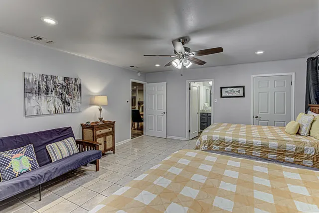 a bedroom with a bed and a lamp