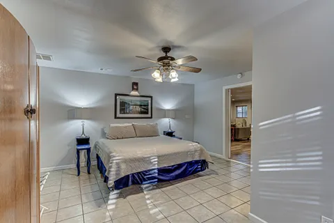a white toilet sitting next to a bathroom sink
