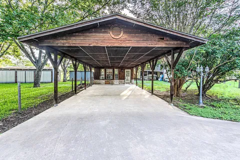 a living room with lots of furniture and a chandelier