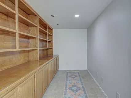 a view of a livingroom with a chandelier fan