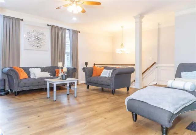 a view of kitchen island wooden floor and chair