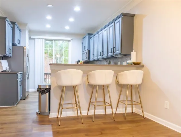 a view of room with window and wooden floor