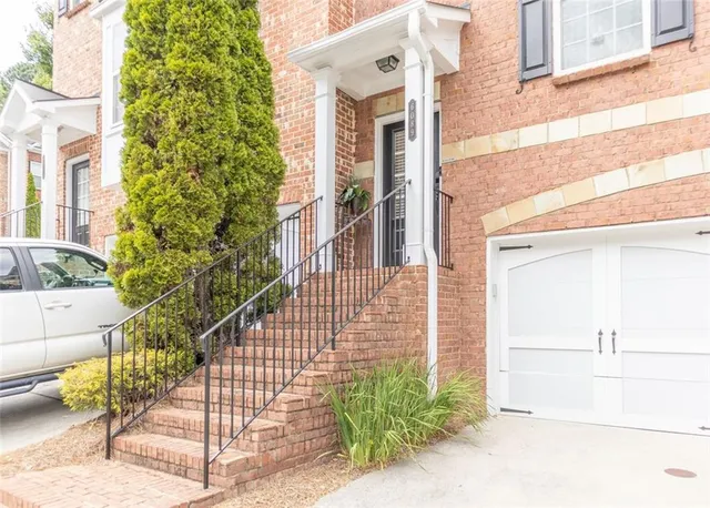 a view of a house with a small yard