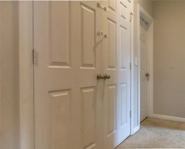 a spacious bedroom with a bed and a window