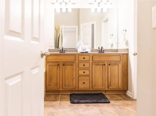 a living room with furniture and flowers