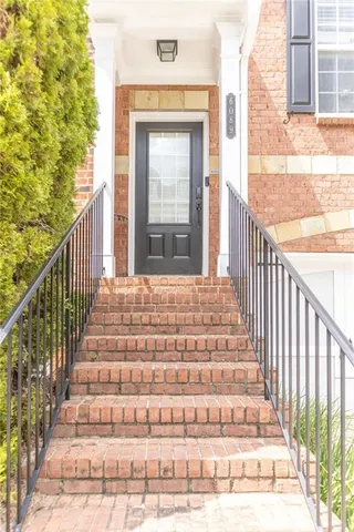 a view of a hallway with a chandelier