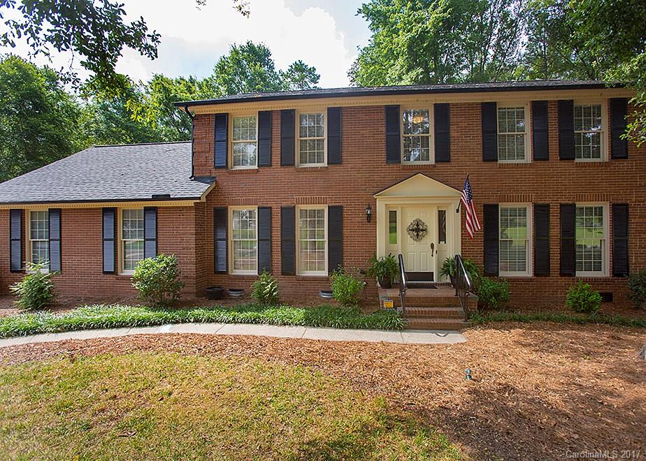 124 Friendfield Drive, Unit 10 Fort Mill, SC 29715 - Photo 1 of 24 a front view of a house with garden