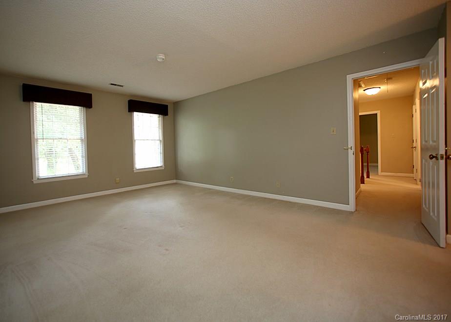 124 Friendfield Drive, Unit 10 Fort Mill, SC 29715 - Photo 11 of 24 an empty room with windows and closet