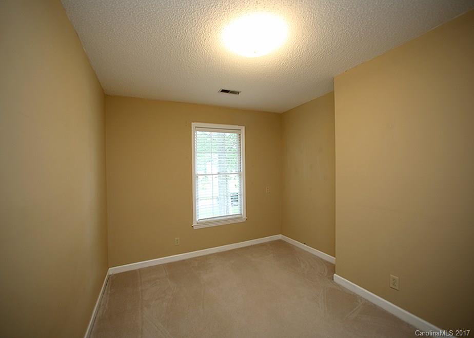 124 Friendfield Drive, Unit 10 Fort Mill, SC 29715 - Photo 13 of 24 an empty room with windows