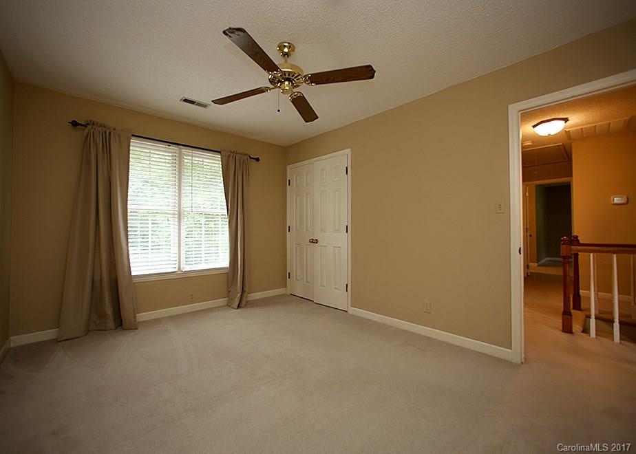 124 Friendfield Drive, Unit 10 Fort Mill, SC 29715 - Photo 14 of 24 a view of a livingroom with a ceiling fan and window