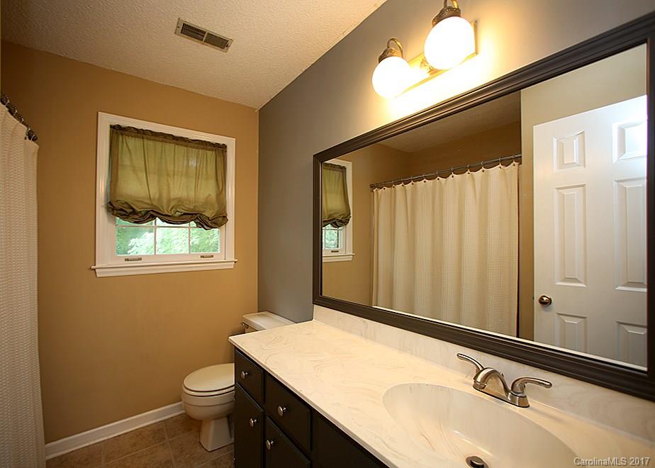 124 Friendfield Drive, Unit 10 Fort Mill, SC 29715 - Photo 16 of 24 a bathroom with a sink and a mirror