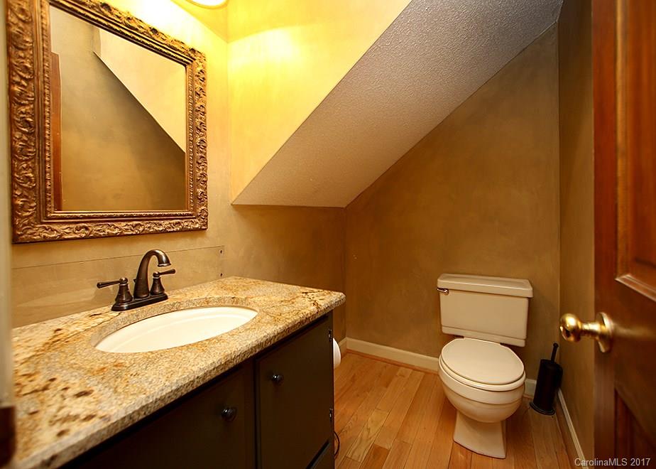 124 Friendfield Drive, Unit 10 Fort Mill, SC 29715 - Photo 17 of 24 a bathroom with a granite countertop sink and a mirror