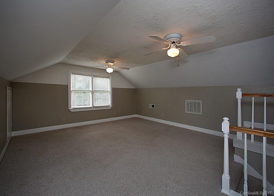 124 Friendfield Drive, Unit 10 Fort Mill, SC 29715 - Photo 19 of 24 an empty room with windows and fan