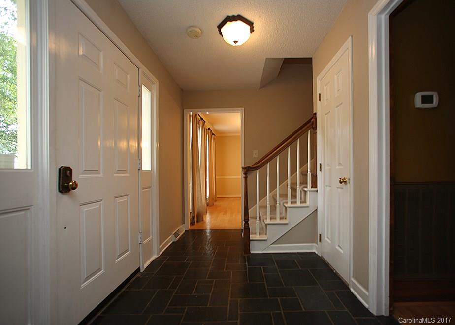 124 Friendfield Drive, Unit 10 Fort Mill, SC 29715 - Photo 3 of 24 a view of a hallway with windows and stairs
