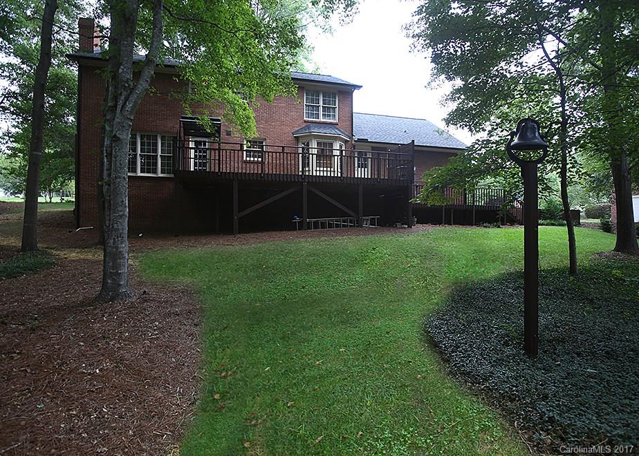124 Friendfield Drive, Unit 10 Fort Mill, SC 29715 - Photo 23 of 24 a view of a house with backyard and a tree