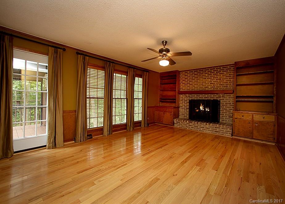 124 Friendfield Drive, Unit 10 Fort Mill, SC 29715 - Photo 5 of 24 a view of an empty room with a fireplace and a window