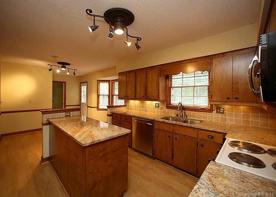 124 Friendfield Drive, Unit 10 Fort Mill, SC 29715 - Photo 6 of 24 a kitchen with a sink appliances and a window