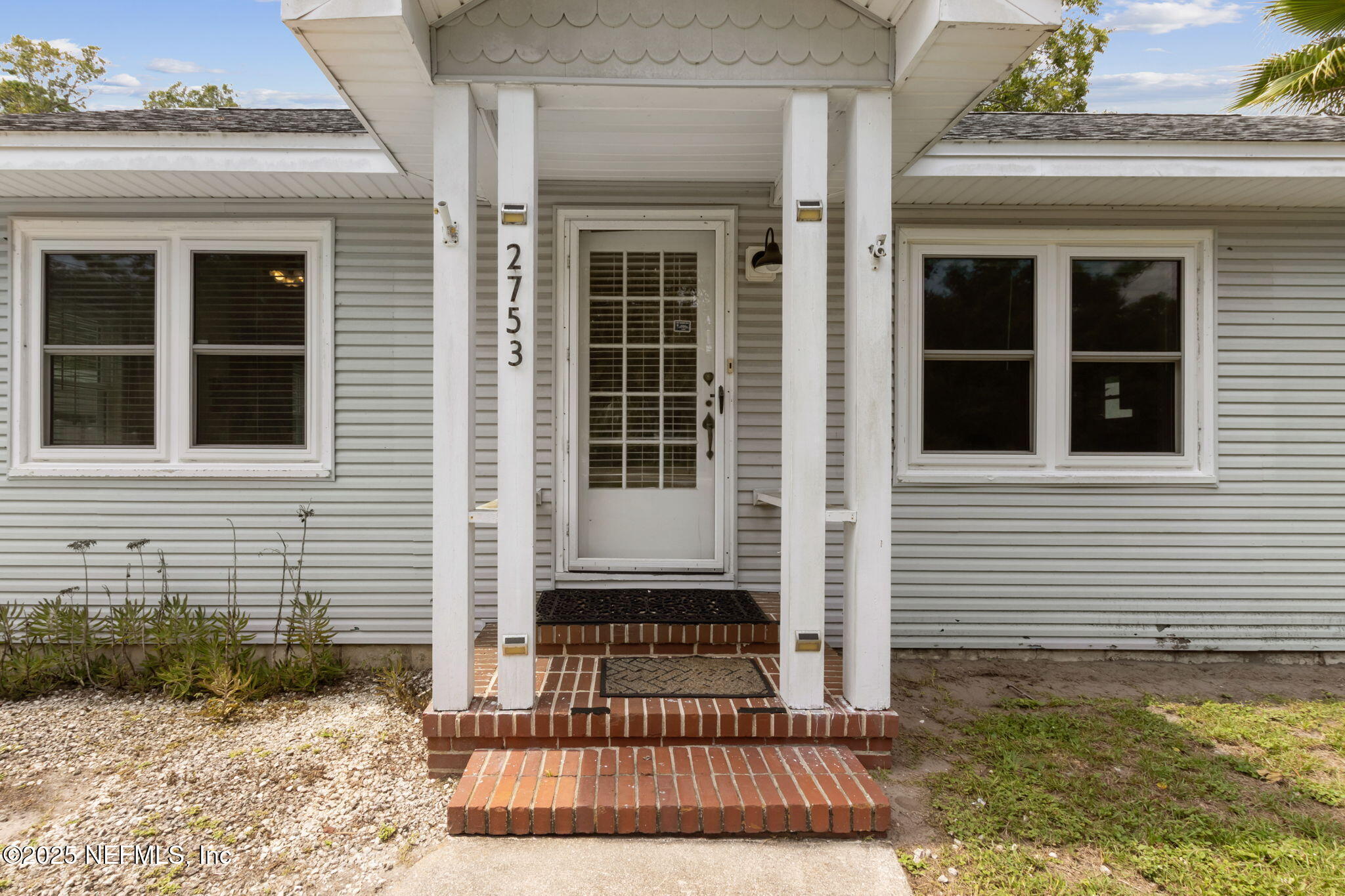 a view of a house with a door and porch