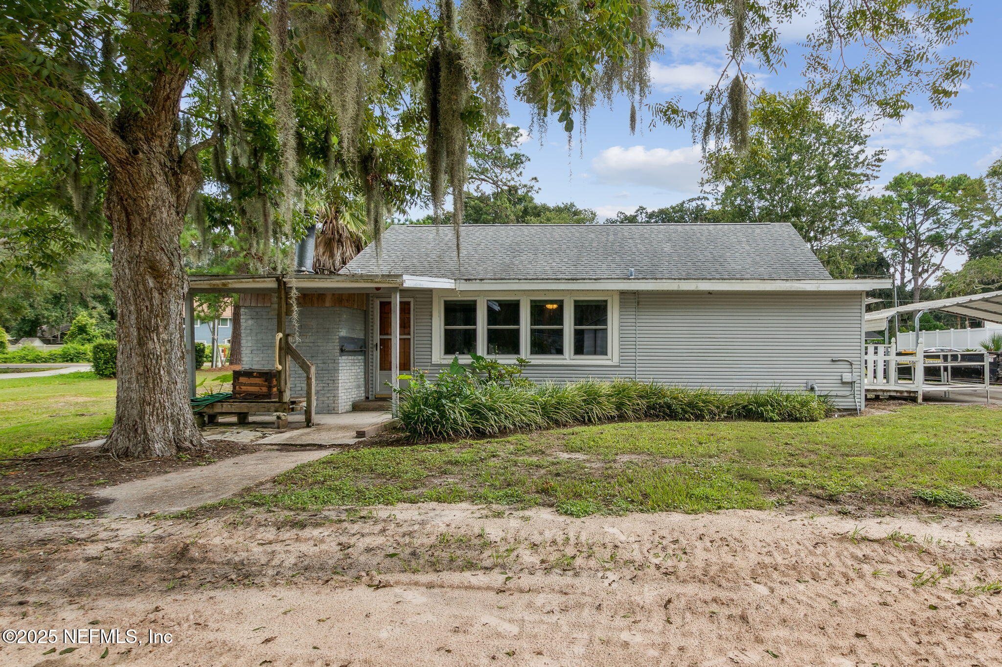 2753 Amelia Road Fernandina Beach, FL 32034 - Photo 2 of 40 a front view of a house with garden