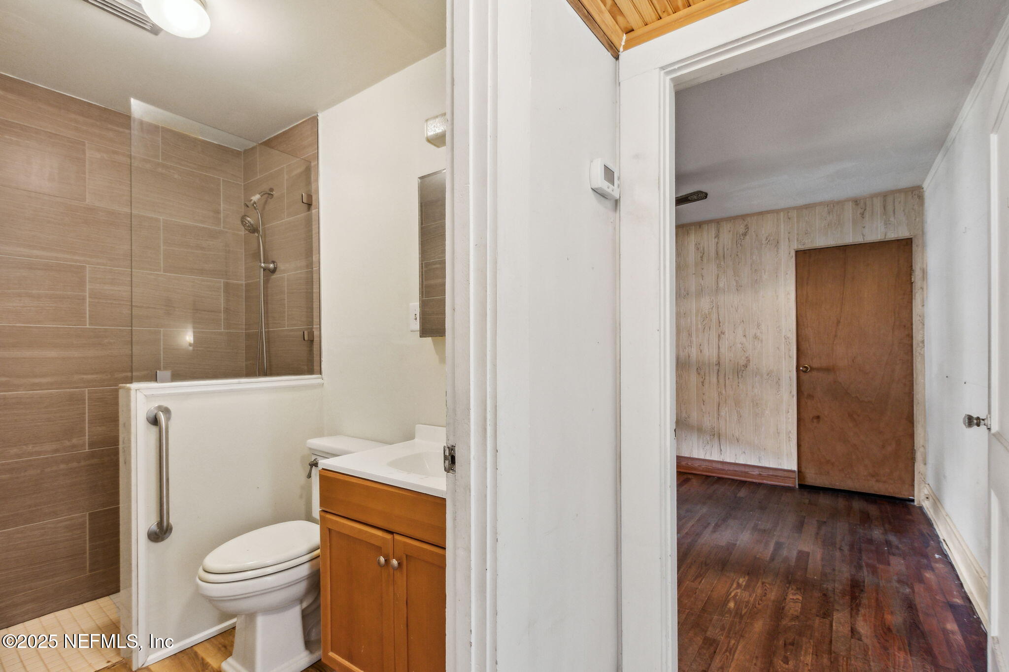 2753 Amelia Road Fernandina Beach, FL 32034 - Photo 22 of 40 a bathroom with a toilet and a shower