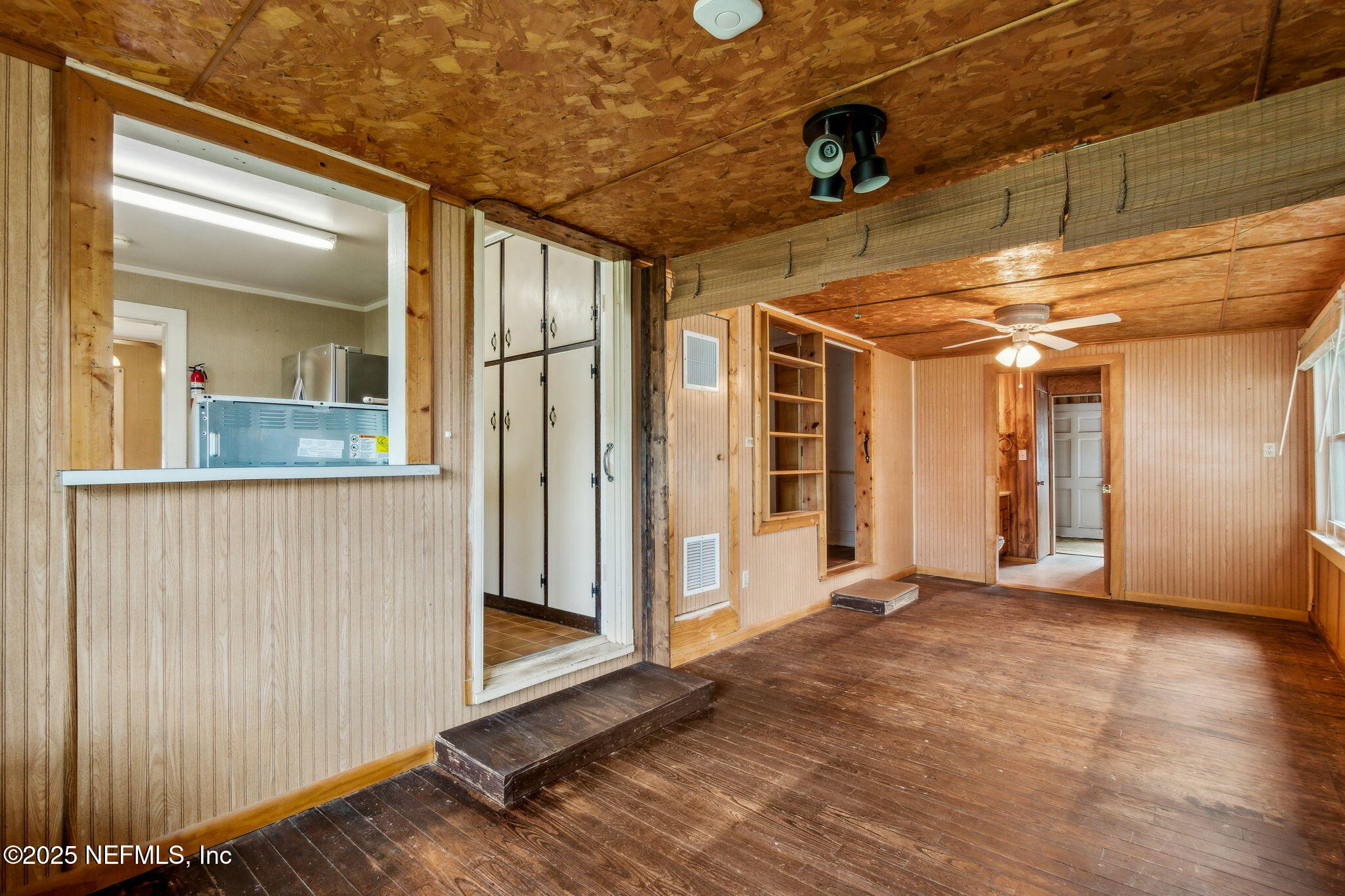 2753 Amelia Road Fernandina Beach, FL 32034 - Photo 23 of 40 a view of a hallway with wooden floor