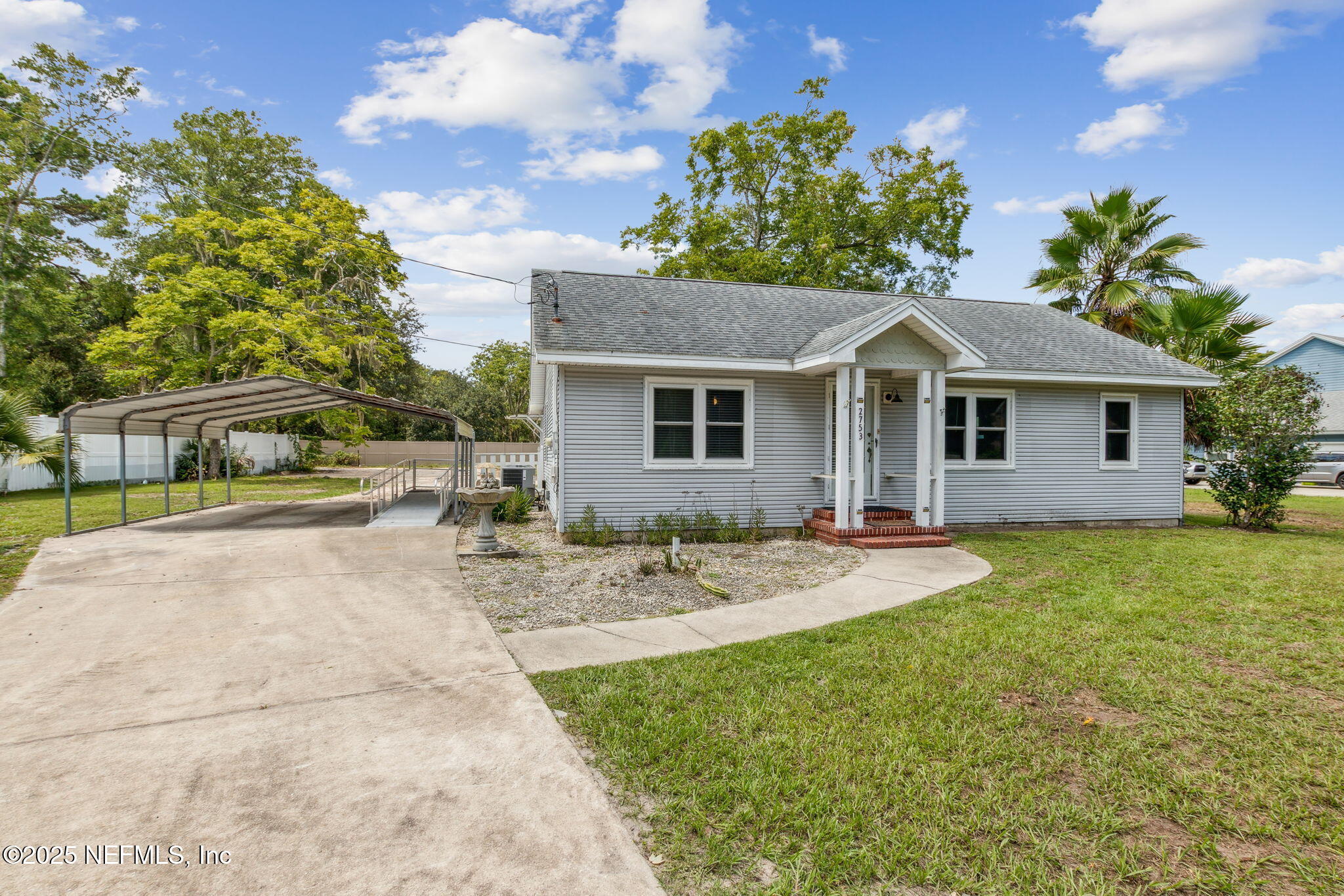 2753 Amelia Road Fernandina Beach, FL 32034 - Photo 25 of 40 a view of a house with backyard and sitting area