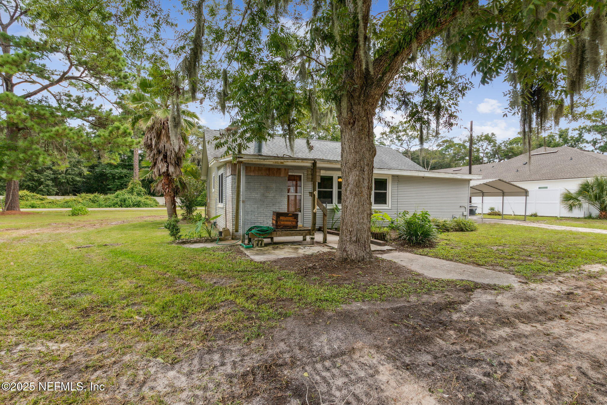2753 Amelia Road Fernandina Beach, FL 32034 - Photo 28 of 40 a view of a house with backyard and sitting area