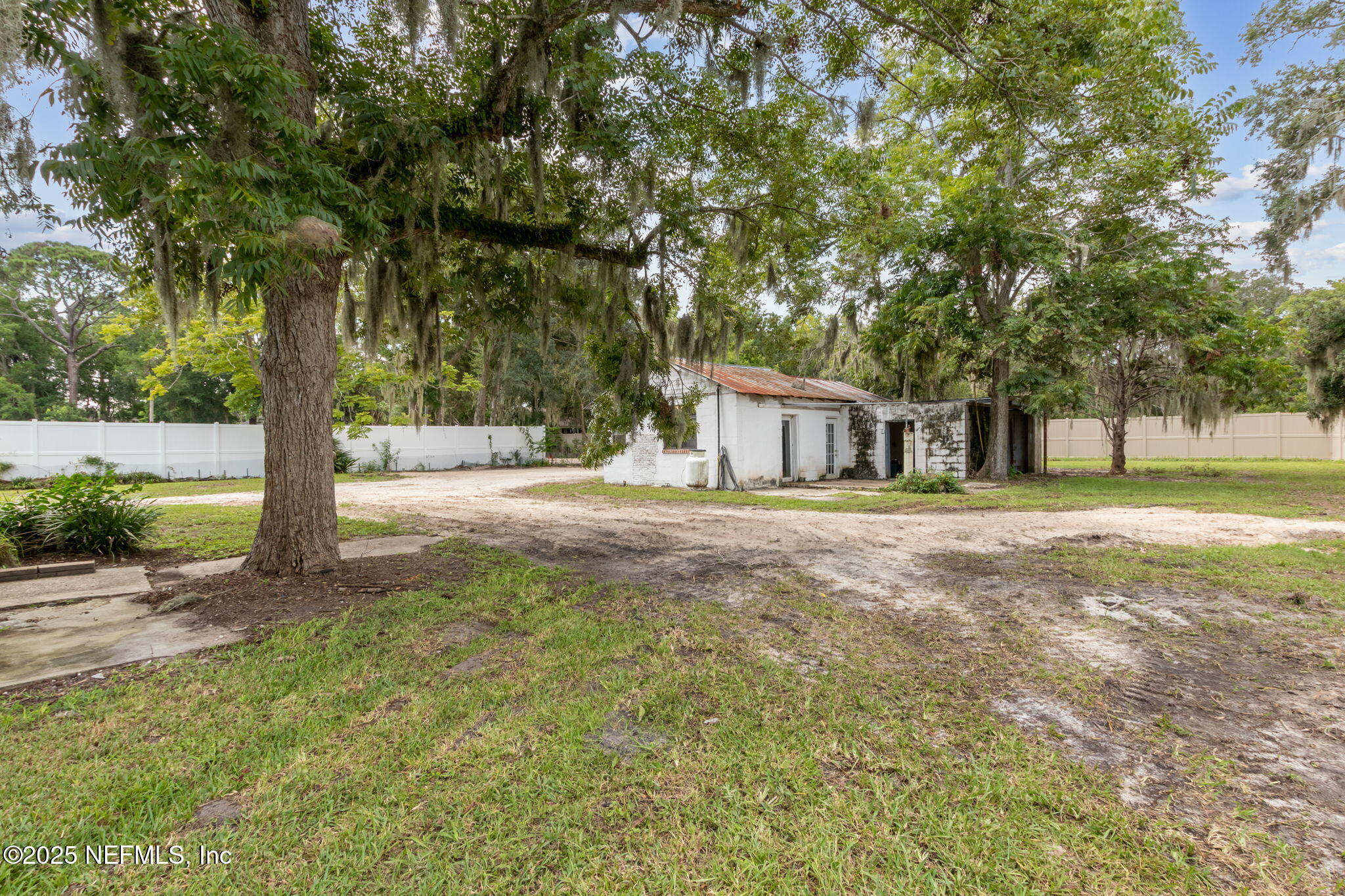 2753 Amelia Road Fernandina Beach, FL 32034 - Photo 30 of 40 a house with trees in front of it