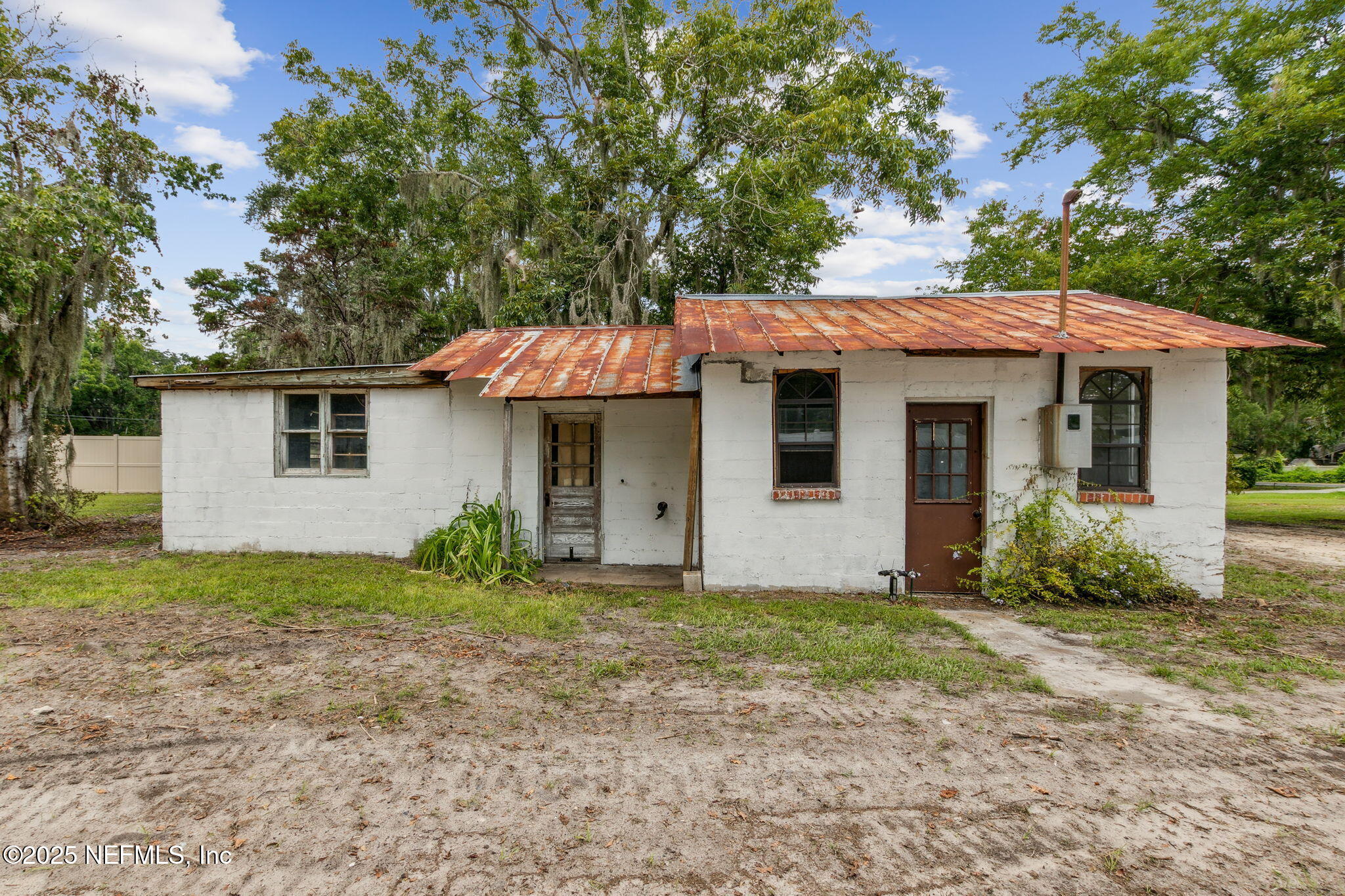 2753 Amelia Road Fernandina Beach, FL 32034 - Photo 3 of 40 a front view of a house with garden