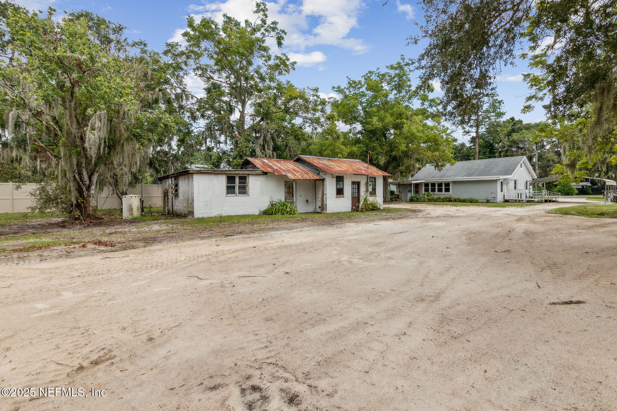 2753 Amelia Road Fernandina Beach, FL 32034 - Photo 31 of 40 a house with trees in the background